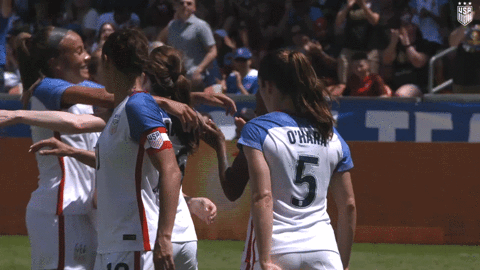 soccer women rejoice after goal